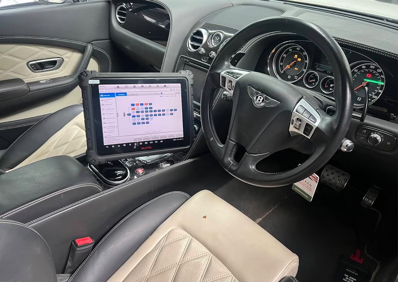 Dealer-level diagnostics tablet inside a Bentley