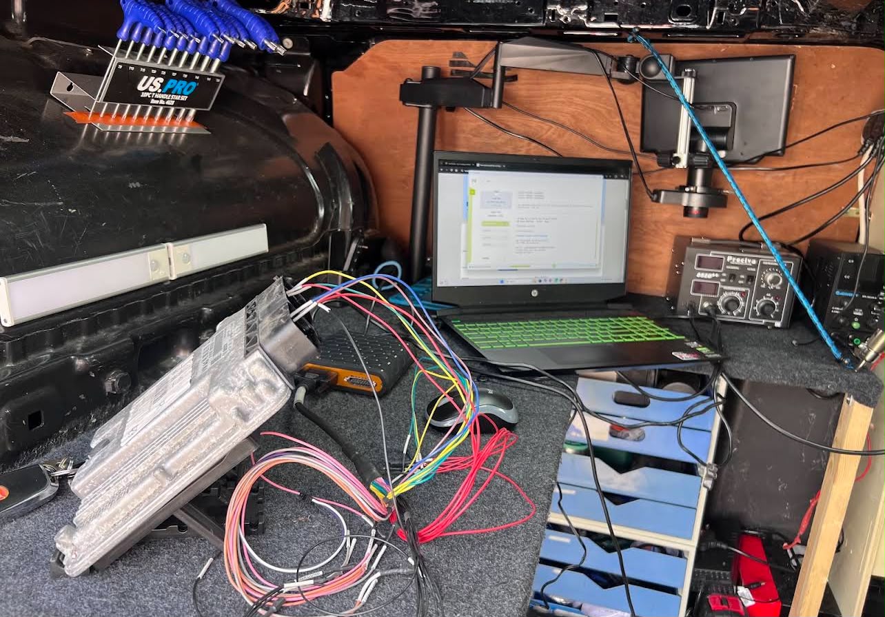 In-van ECU bench station with wiring loom and laptop